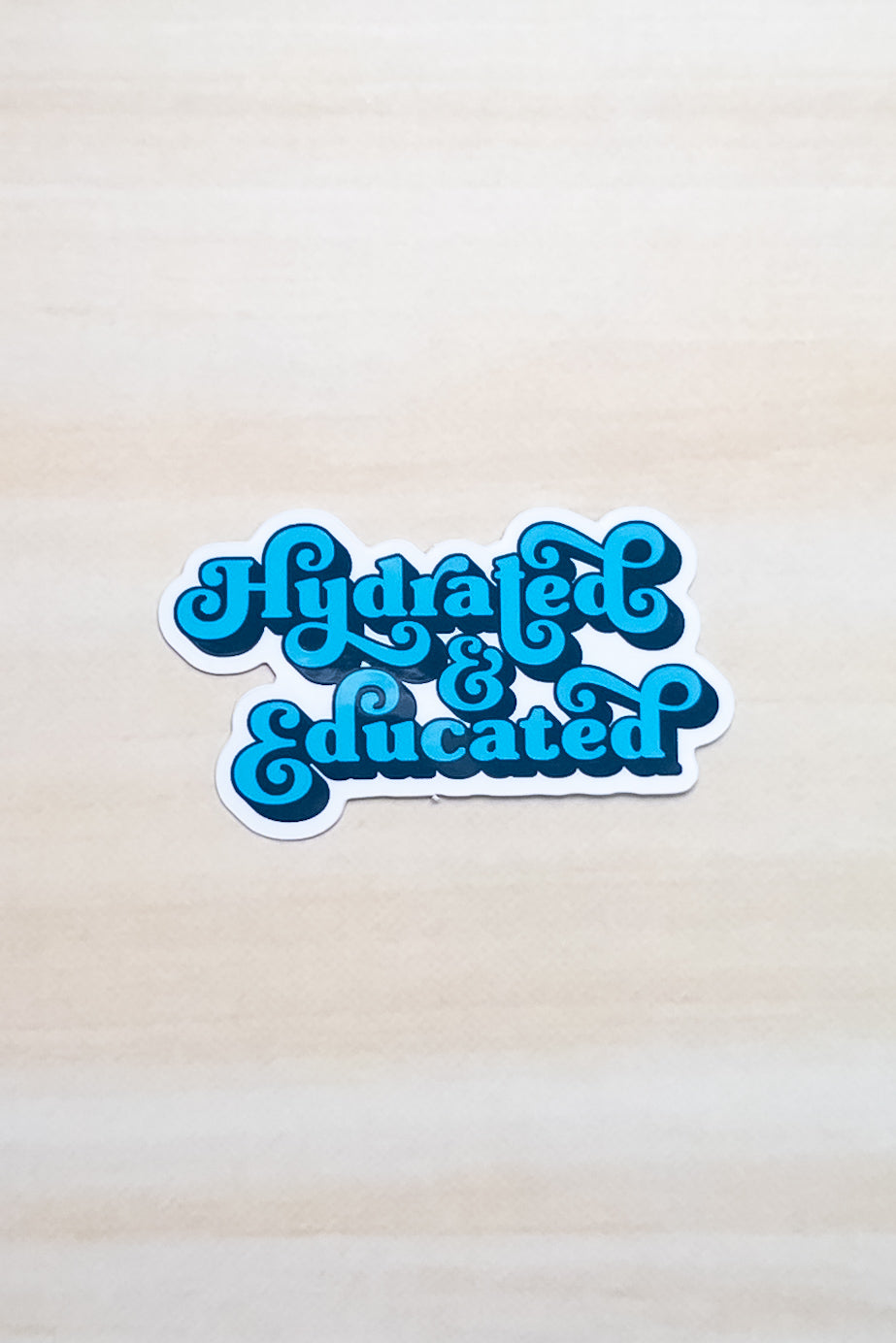 Hydrated & Educated Vinyl Sticker – 2" Retro Blue Quote Sticker – Waterproof Motivational Sticker for Laptop, or Water Bottle